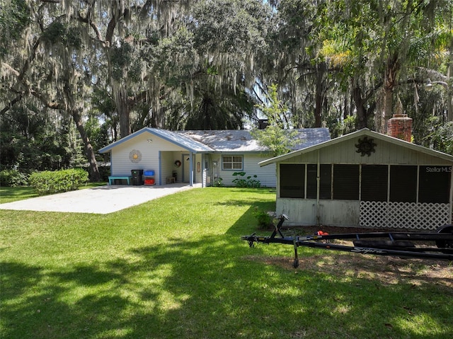 rear view of house with a lawn