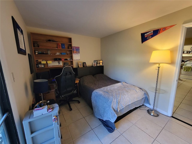 bedroom with light tile patterned floors