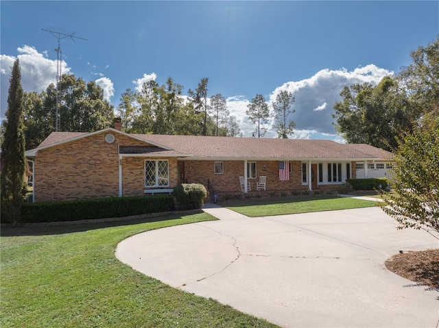 ranch-style home with a front yard