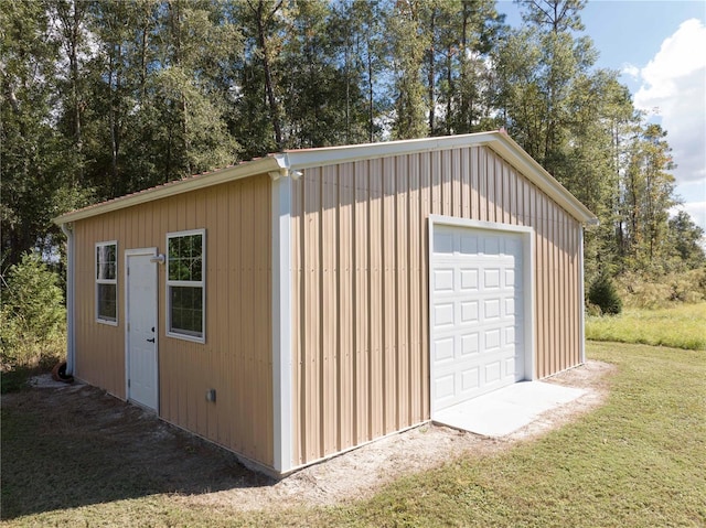 garage featuring a lawn