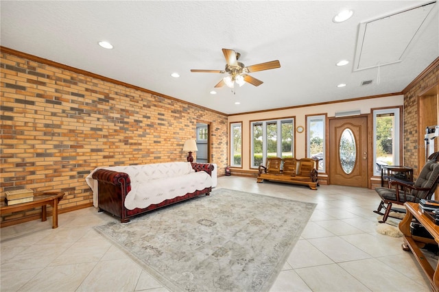 living room with light tile floors, brick wall, and ceiling fan