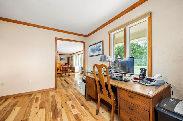 office area with crown molding and light wood-type flooring