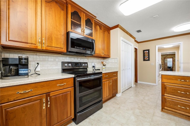 kitchen with black electric range oven, light tile floors, a textured ceiling, tasteful backsplash, and crown molding