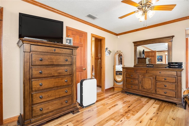 bedroom featuring crown molding, ceiling fan, and light hardwood / wood-style flooring