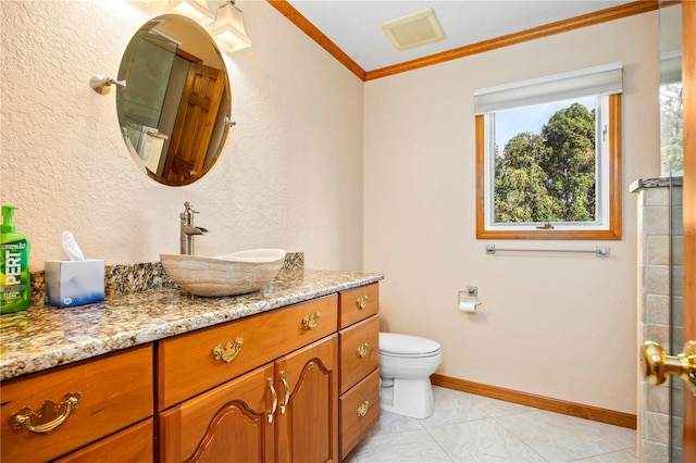 bathroom with tile floors, toilet, ornamental molding, and vanity