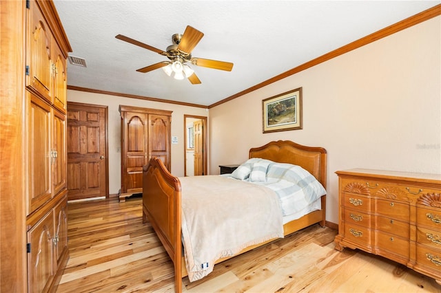 bedroom featuring ornamental molding, ceiling fan, and light hardwood / wood-style flooring