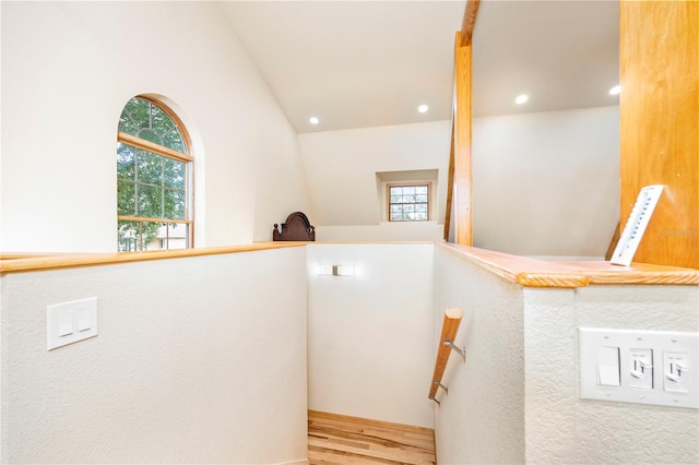 stairway with hardwood / wood-style flooring