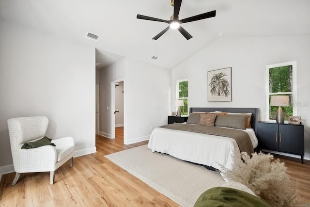 bedroom featuring lofted ceiling, ceiling fan, and light hardwood / wood-style flooring