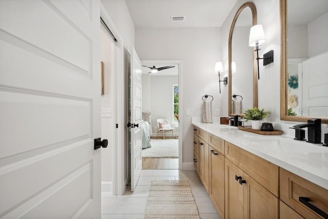 bathroom with vanity and tile patterned floors