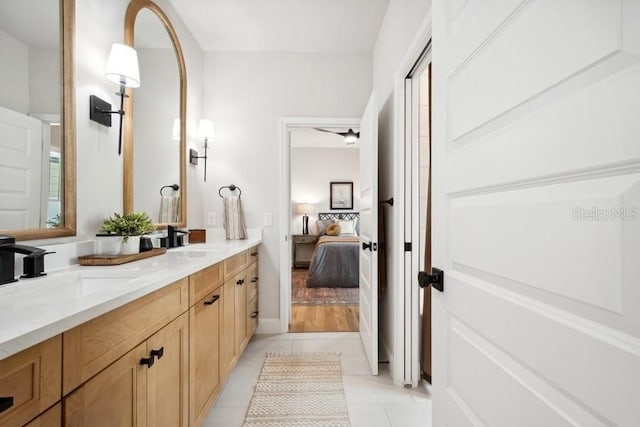 bathroom with vanity, tile patterned flooring, and ceiling fan