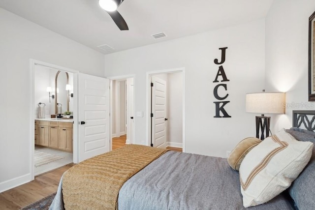 bedroom featuring connected bathroom, ceiling fan, and light hardwood / wood-style flooring