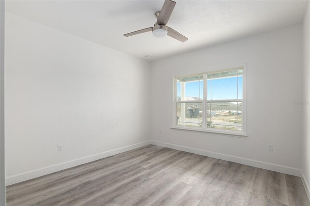 unfurnished room featuring ceiling fan and light wood-type flooring