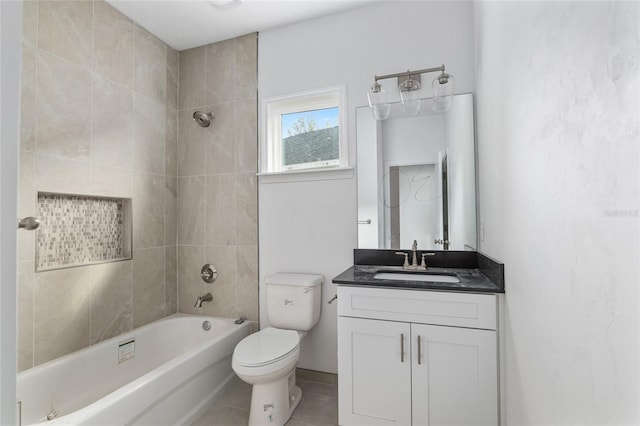 full bathroom featuring tiled shower / bath combo, tile floors, oversized vanity, and toilet