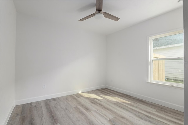 empty room with ceiling fan and light wood-type flooring