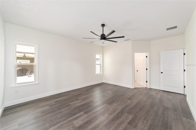 unfurnished room featuring ceiling fan and dark hardwood / wood-style floors