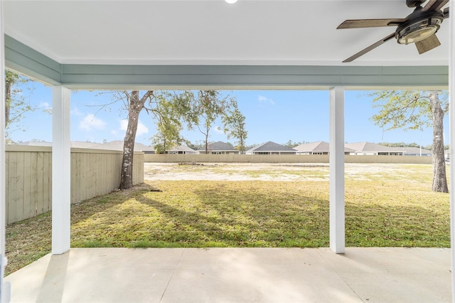 view of yard featuring a patio and ceiling fan