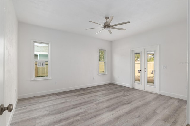 empty room featuring ceiling fan and light wood-type flooring