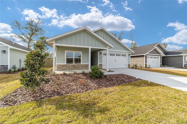 craftsman house with a front yard and a garage