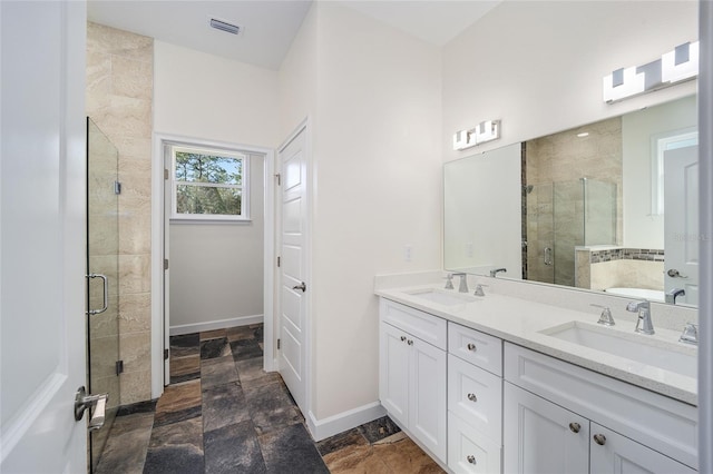 bathroom featuring shower with separate bathtub, dual vanity, and tile patterned floors