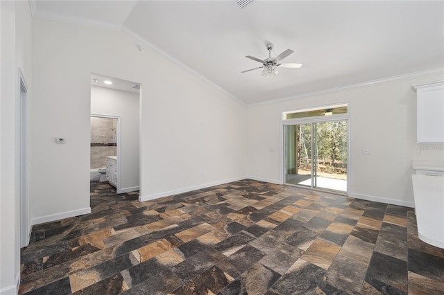 unfurnished living room with ornamental molding, dark tile patterned floors, ceiling fan, and vaulted ceiling