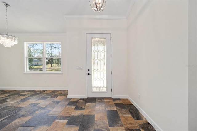 entrance foyer featuring crown molding and an inviting chandelier