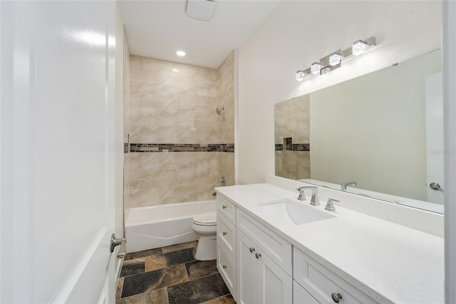 full bathroom with vanity, tile patterned flooring, tiled shower / bath combo, and toilet