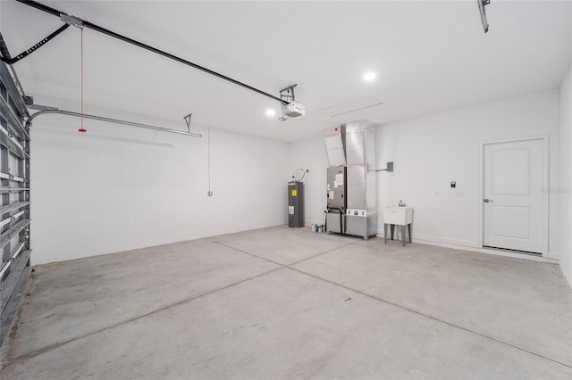 garage with heating unit, a garage door opener, sink, and water heater