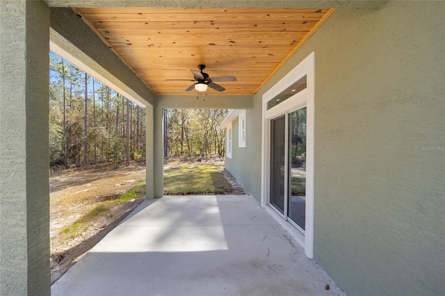 view of patio featuring ceiling fan