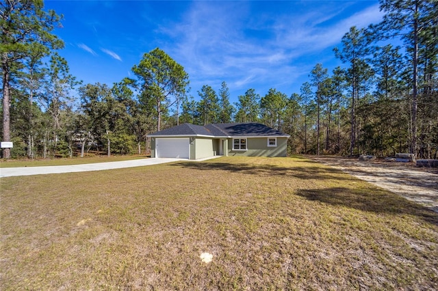 single story home with a garage and a front yard