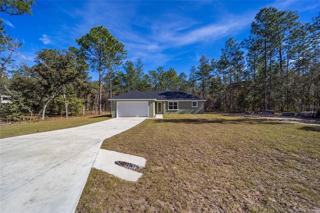 ranch-style house featuring a garage and a front lawn