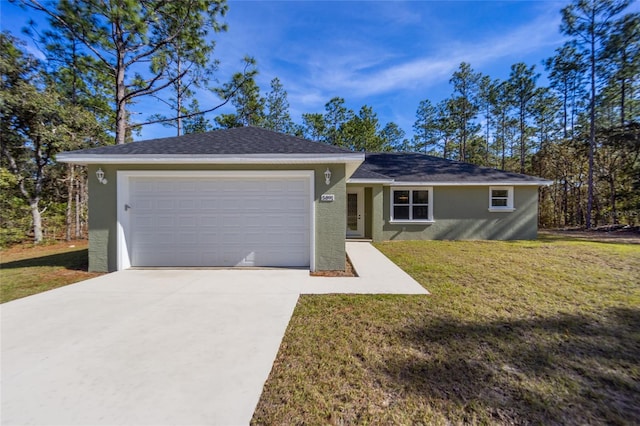 ranch-style house featuring a garage and a front lawn