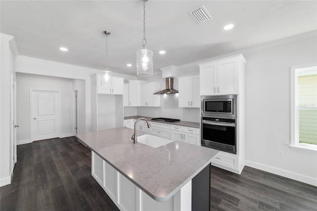 kitchen with dark hardwood / wood-style floors, decorative backsplash, wall chimney range hood, and stainless steel appliances