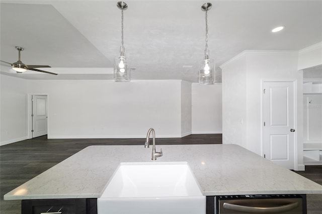 kitchen with a kitchen island with sink, ceiling fan, dark hardwood / wood-style floors, and light stone countertops