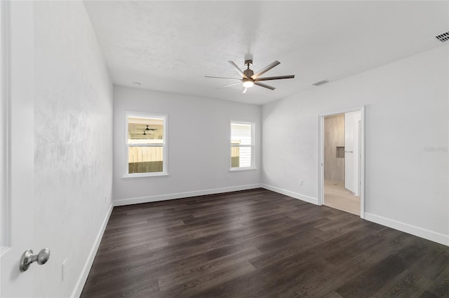 spare room featuring wood-type flooring and ceiling fan