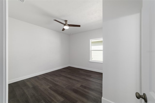 unfurnished room featuring ceiling fan and dark hardwood / wood-style floors