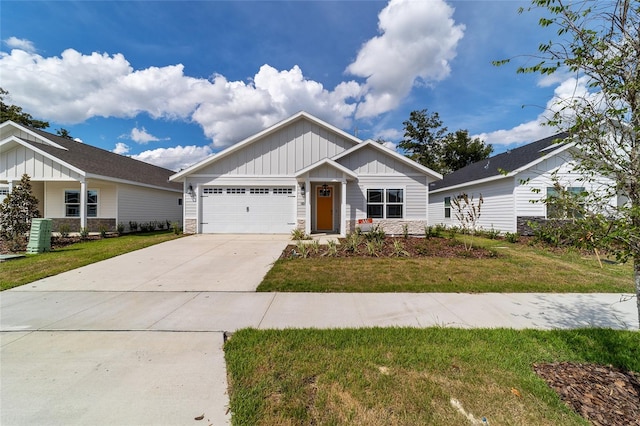 craftsman-style home with a garage and a front lawn