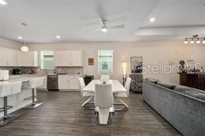 dining area featuring dark hardwood / wood-style floors and ceiling fan