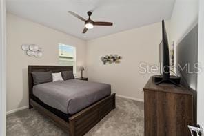 bedroom featuring light carpet and ceiling fan