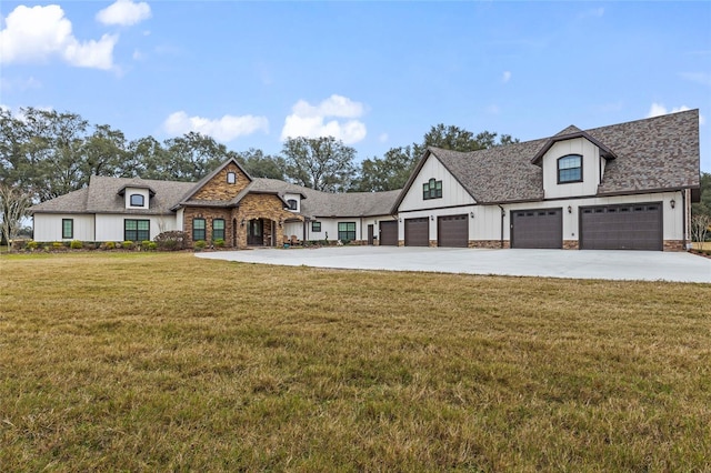 french country inspired facade featuring a front yard and a garage