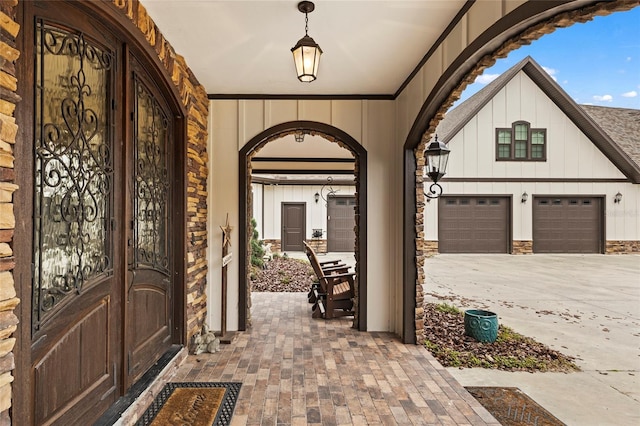 interior space with covered porch and a garage