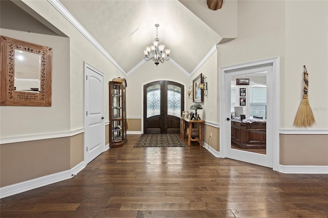 foyer featuring a chandelier, vaulted ceiling, french doors, and dark hardwood / wood-style flooring