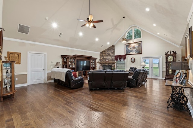 living room featuring dark hardwood / wood-style floors, ceiling fan, ornamental molding, a fireplace, and high vaulted ceiling