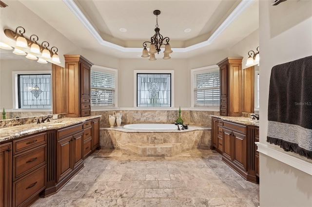 bathroom featuring a relaxing tiled bath, tile floors, a chandelier, and vanity with extensive cabinet space