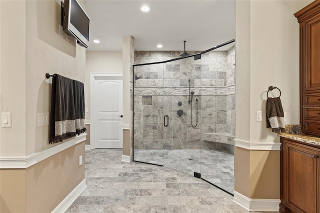 bathroom with tile floors and a shower with shower door