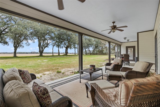 view of terrace with outdoor lounge area and ceiling fan