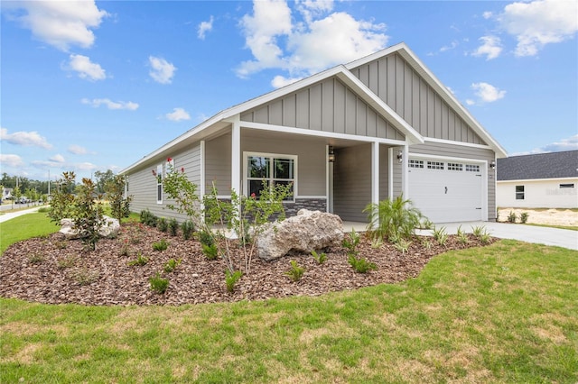 view of front of house with a garage, a porch, and a front lawn