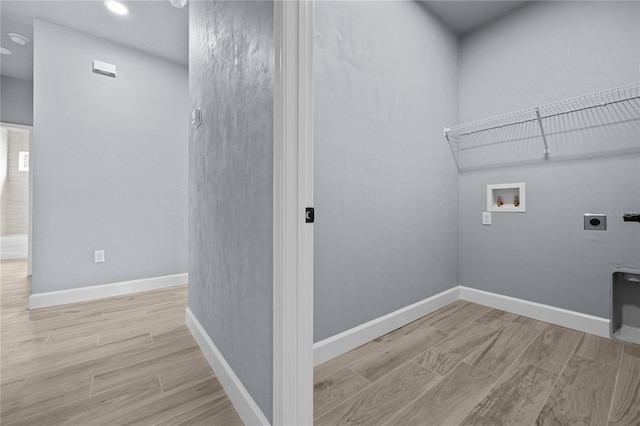 6624 SW 10th Ln, Gainesville, FL 32607 - laundry room with electric dryer hookup, washer hookup, wood finished floors, baseboards, and recessed lighting