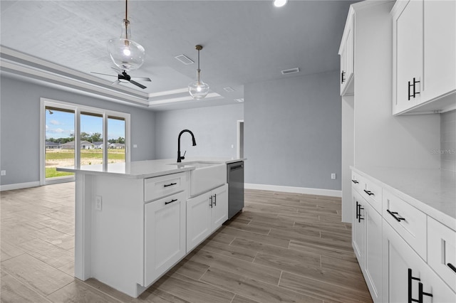 6624 SW 10th Ln, Gainesville, FL 32607 - kitchen featuring stainless steel dishwasher, a tray ceiling, ceiling fan, wood finish floors, and recessed lighting