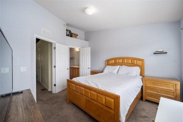 bedroom featuring carpet flooring and visible vents