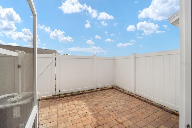 view of patio featuring a fenced backyard and a gate
